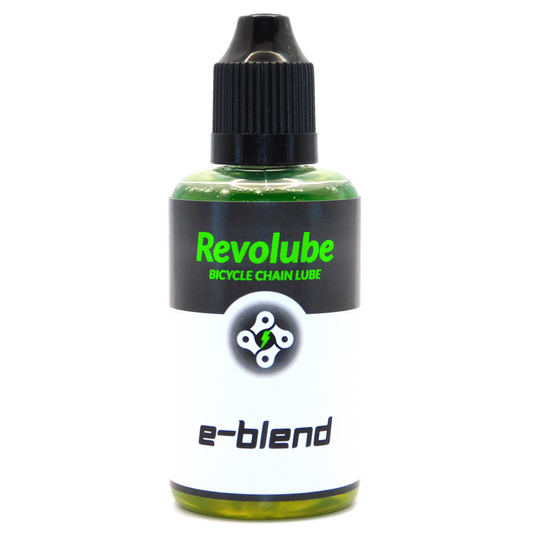 A 50ml plastic bottle of Revolubes e-blend bicycle chain lube with a precision applicator, designed for use in electric bikes.