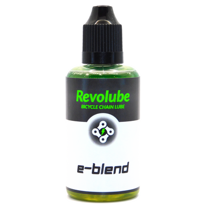 A 50ml plastic bottle of Revolubes e-blend bicycle chain lube with a precision applicator, designed for use in electric bikes.